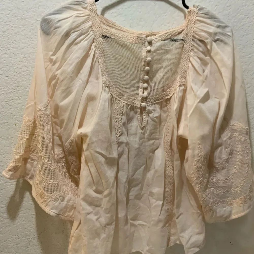 Anthropologie eyelet bell sleeve peasant top